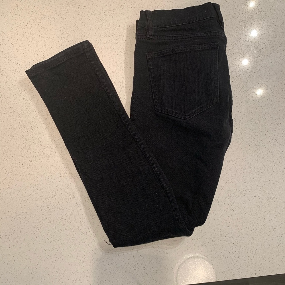 Black ripped RUDE stinger jeans.